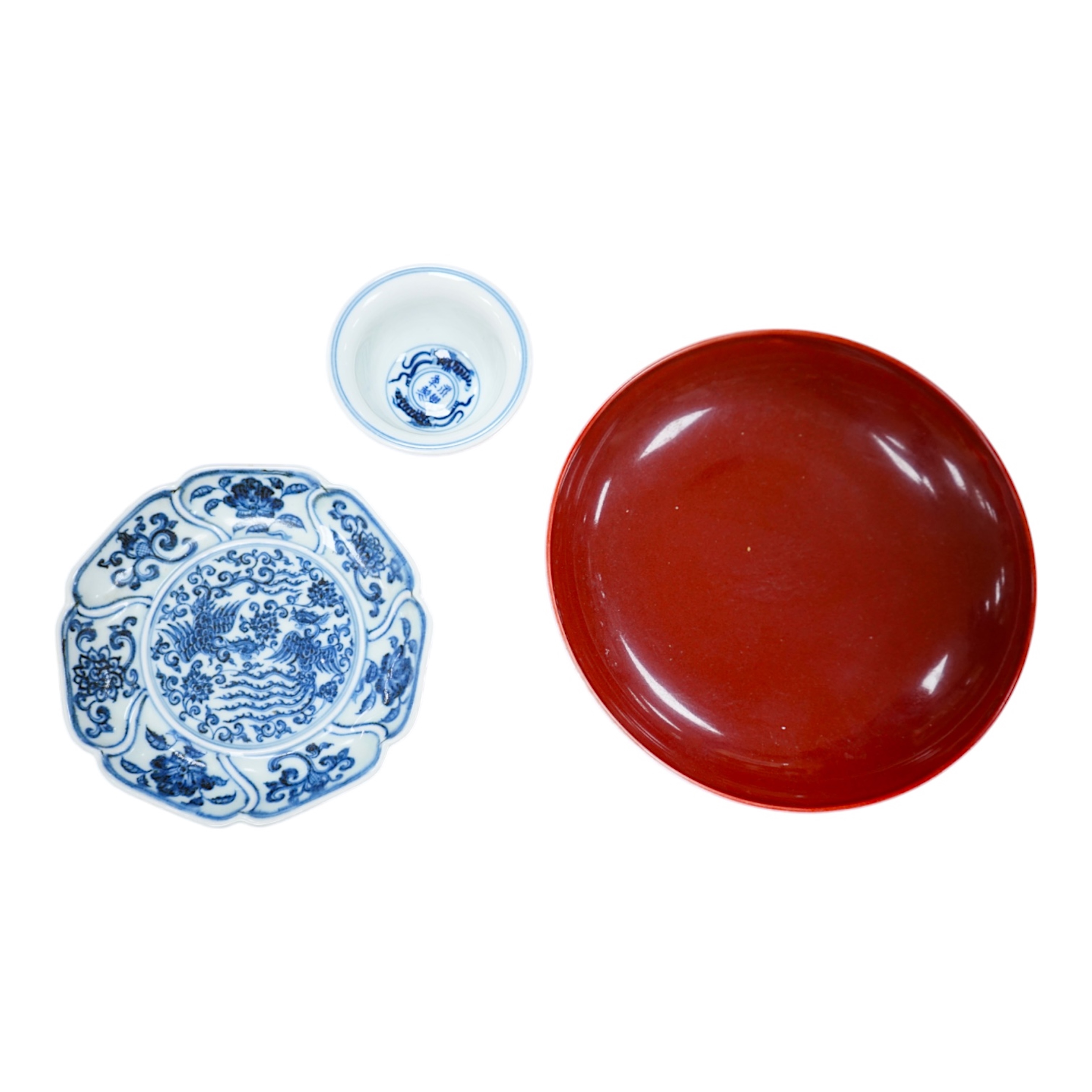 A Chinese copper red glazed dish, a blue and white bowl and a similar dish, bowl 22.5cm diameter. Condition - good